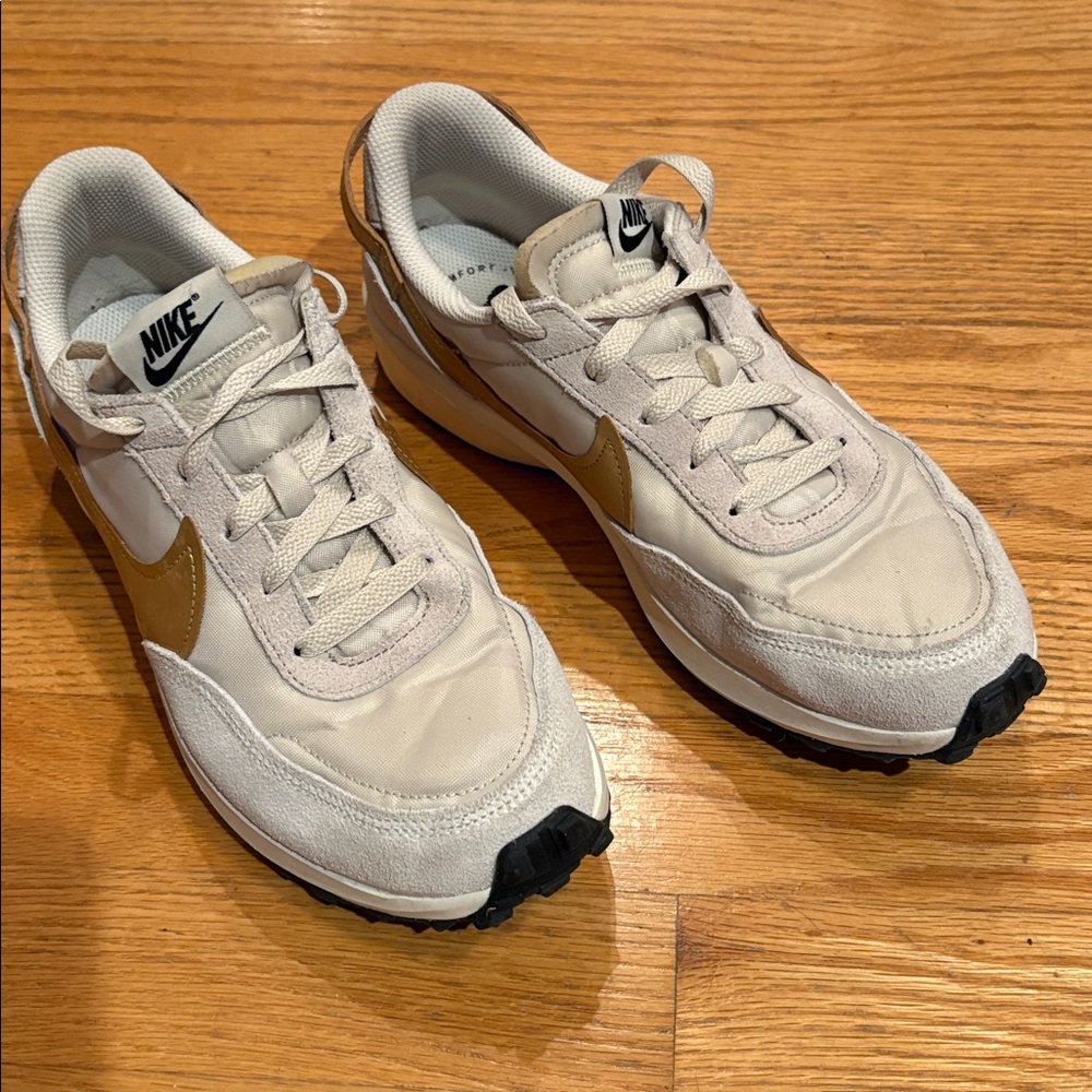 Nike Cream Sneakers with Gold Accents
Used but not overworn